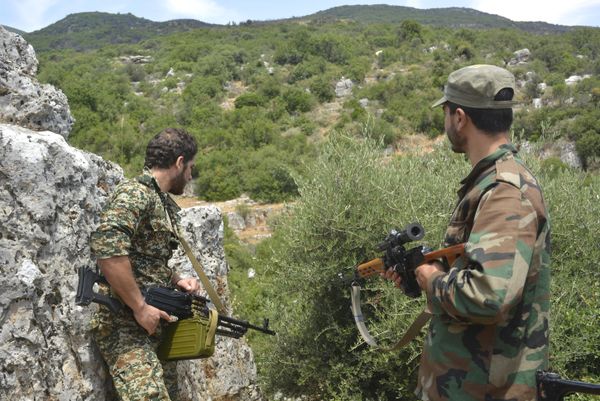 Syrian pro-government forces patrol an area in Hama province. (File) Syrian pro-government forces patrol an area in Hama province. (File) - Sputnik International