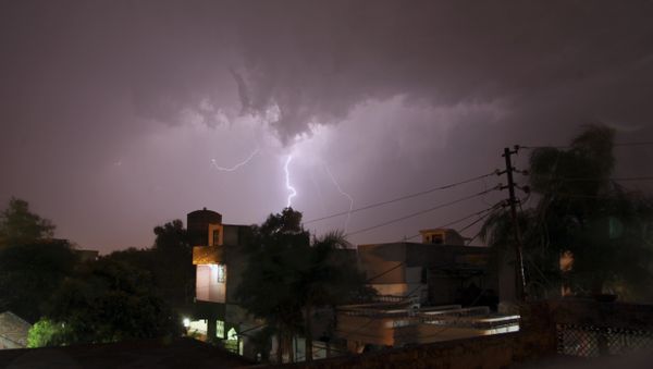 In this Sunday, May 17, 2015 photo, bolt of lightning illuminates the night sky in Jammu, India. In this Sunday, May 17, 2015 photo, bolt of lightning illuminates the night sky in Jammu, India. - Sputnik International