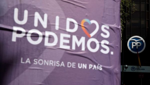 Posters of the coalition of Unidos Podemos (United We Can) hang near the People's Party (PP) headquarters in Madrid, Spain  - Sputnik International