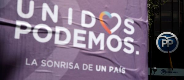 Posters of the coalition of Unidos Podemos (United We Can) hang near the People's Party (PP) headquarters in Madrid, Spain - Sputnik International