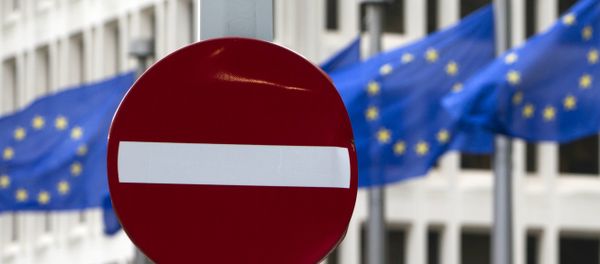 EU flags flutter in the wind in back of a no entry street sign in front of EU headquarters in Brussels on Friday, June 24, 2016. - Sputnik International