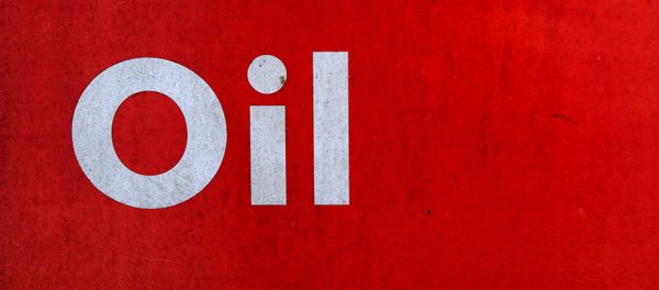 The word oil is pictured on an oil bank at a recycling yard in London - Sputnik International