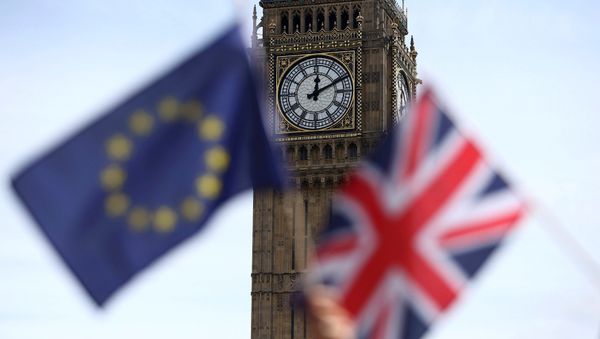 Participants hold a British Union flag and an EU flag during a pro-EU referendum event at Parliament Square in London. Participants hold a British Union flag and an EU flag during a pro-EU referendum event at Parliament Square in London. - Sputnik International