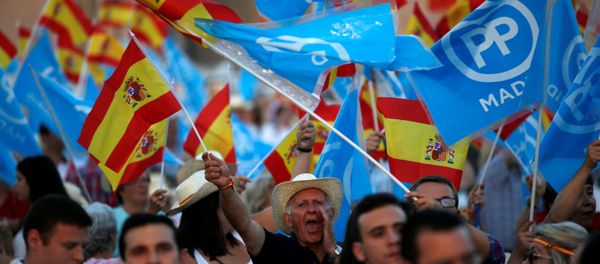 Popular Party supporters hold Spanish flags as they wait for the arrival of Spain's acting Prime Minister and People's Party (PP) leader Mariano Rajoy before the final campaign rally for Spain's general election in Madrid, Spain, June 24, 2016 Popular Party supporters hold Spanish flags as they wait for the arrival of Spain's acting Prime Minister and People's Party (PP) leader Mariano Rajoy before the final campaign rally for Spain's general election in Madrid, Spain, June 24, 2016 - Sputnik International