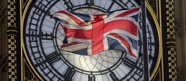 The Union flag is seen flapping in the wind in front of one of the faces of the Great Clock atop the landmark Elizabeth Tower that houses Big Ben at the Houses of Parliament where lawmakers are expected to vote in favour of joining air strikes against Islamic State (IS) militants in central London on 26 September, 2014 The Union flag is seen flapping in the wind in front of one of the faces of the Great Clock atop the landmark Elizabeth Tower that houses Big Ben at the Houses of Parliament where lawmakers are expected to vote in favour of joining air strikes against Islamic State (IS) militants in central London on 26 September, 2014 - Sputnik International