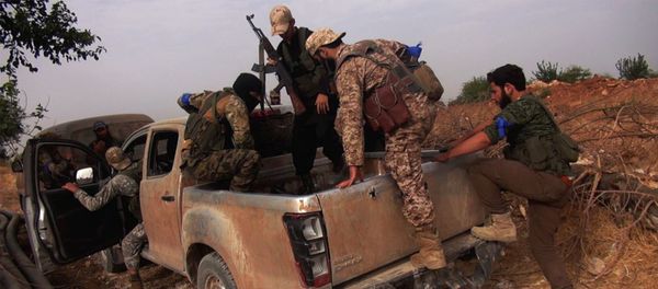 This image posted on the Twitter page of Syria's al-Qaida-linked Nusra Front on Wednesday, June 15, 2016, which is consistent with AP reporting, shows Nusra Front fighters on their vehicle preparing to leave and battle against Syrian troops and pro-government gunmen, at the hilltop of Khalsa village, southern Aleppo, Syria - Sputnik International