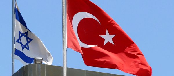 A Turkish flag flutters atop the Turkish embassy as an Israeli flag is seen nearby, in Tel Aviv, Israel, June 26, 2016 - Sputnik International