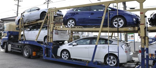 A carrier transports Toyota vehicles including the new Prius hybrid vehicles near the Toyota Motor Corp. Tsutsumi Plant in the town of Toyota, Japan's Aichi Prefecture - Sputnik International