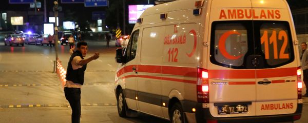 A policeman gestures in front of an ambulance at Istanbul Ataturk airport, Turkey, following a blast June 28, 2016. A policeman gestures in front of an ambulance at Istanbul Ataturk airport, Turkey, following a blast June 28, 2016. - Sputnik International