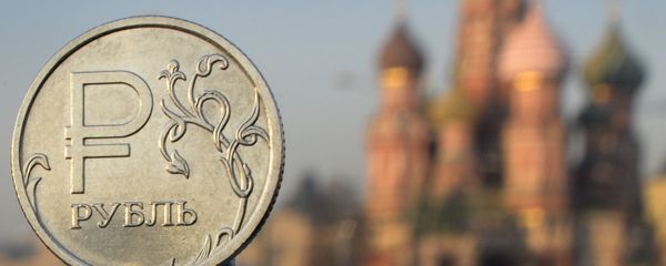 A Russian ruble coin is pictured in front of St. Basil cathedral in central Moscow A Russian ruble coin is pictured in front of St. Basil cathedral in central Moscow - Sputnik International