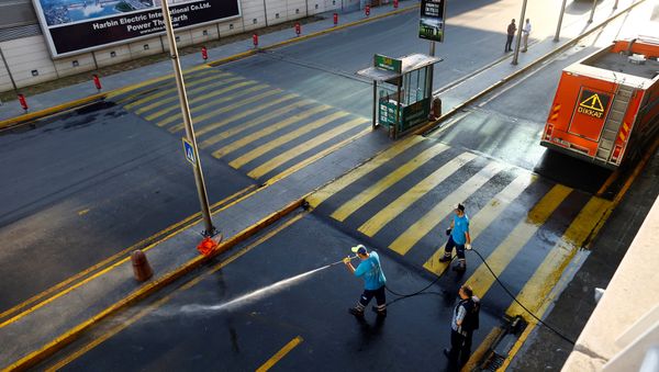 Workers wash the road at Turkey's largest airport, Istanbul Ataturk, following yesterday's blast June 29, 2016 - Sputnik International