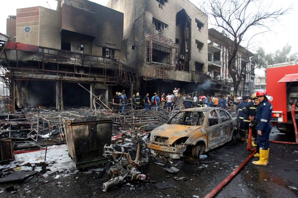 People gather at the site of a suicide car bomb in the Karrada shopping area, in Baghdad, Iraq July 3, 2016. People gather at the site of a suicide car bomb in the Karrada shopping area, in Baghdad, Iraq July 3, 2016. - Sputnik International