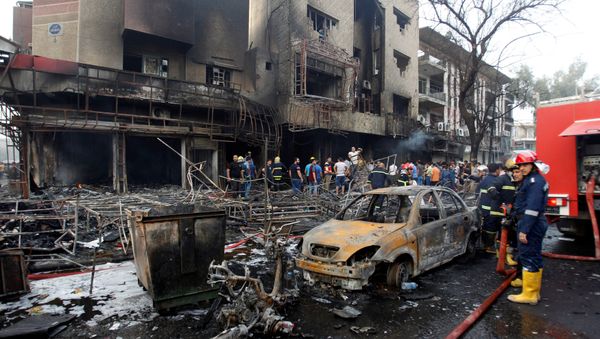 People gather at the site of a suicide car bomb in the Karrada shopping area, in Baghdad, Iraq July 3, 2016 People gather at the site of a suicide car bomb in the Karrada shopping area, in Baghdad, Iraq July 3, 2016 - Sputnik International