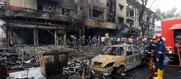 People gather at the site of a suicide car bomb in the Karrada shopping area, in Baghdad, Iraq July 3, 2016 People gather at the site of a suicide car bomb in the Karrada shopping area, in Baghdad, Iraq July 3, 2016 - Sputnik International