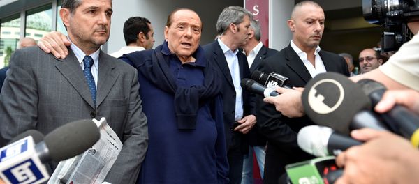 Italian tycoon and former prime minister Silvio Berlusconi talks with reporters as he leaves the hospital after a heart surgery in Milan, Italy July 5, 2016 - Sputnik International