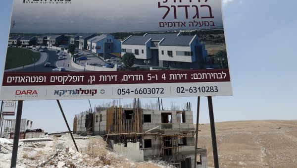 A picture taken on July 4, 2016, shows buildings under construction in the Israeli settlement of Maale Adumim, east of Jerusalem in the occupied West Bank. - Sputnik International