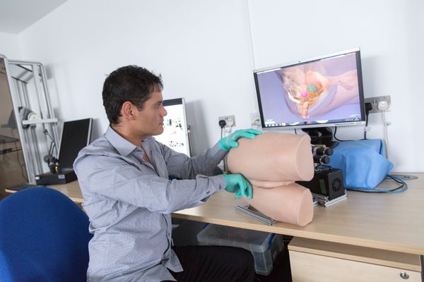 Dr Alejandro Granados from Imperial College London demonstrates the robotic rectum technology, which he has developed to enable medics to practise rectal exams. - Sputnik International