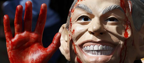 A demonstrator wearing a mask to impersonate Tony Blair protests before the release of the John Chilcot report into the Iraq war, at the Queen Elizabeth II centre in London, Britain July 6, 2016. A demonstrator wearing a mask to impersonate Tony Blair protests before the release of the John Chilcot report into the Iraq war, at the Queen Elizabeth II centre in London, Britain July 6, 2016. - Sputnik International