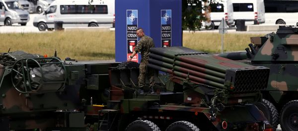 Polish soldier prepares a military exhibition in front of the venue of the NATO Summit, which will start in two days, in Warsaw, Poland, July 6, 2016. Polish soldier prepares a military exhibition in front of the venue of the NATO Summit, which will start in two days, in Warsaw, Poland, July 6, 2016. - Sputnik International