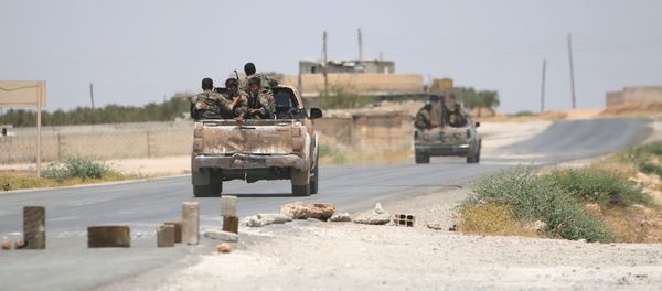 Syria Democratic Forces (SDF) ride vehicles along a road near Manbij, in Aleppo Governorate, Syria, June 25, 2016. - Sputnik International