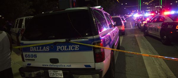 Police cars sit on Main Street in Dallas following the sniper shooting during a protest on July 7, 2016. Police cars sit on Main Street in Dallas following the sniper shooting during a protest on July 7, 2016. - Sputnik International