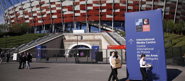 People walk outside PGE National Stadium, the venue of the NATO Summit, in Warsaw, Poland July 8, 2016. People walk outside PGE National Stadium, the venue of the NATO Summit, in Warsaw, Poland July 8, 2016. - Sputnik International