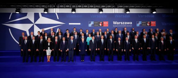 NATO heads of state and other leaders participate in a family photo at the NATO Summit in Warsaw, Poland July 8, 2016. - Sputnik International