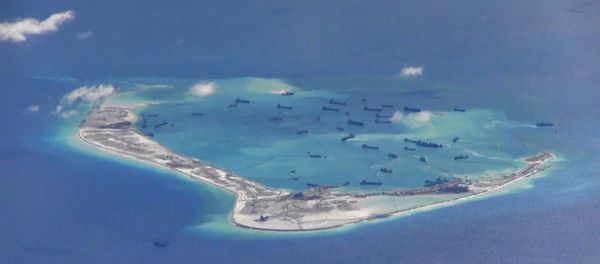 Chinese dredging vessels in the waters around Mischief Reef in the disputed Spratly Islands in the South China Sea in this still image from video taken by a P-8A Poseidon surveillance aircraft provided by the United States Navy May 21, 2015. Chinese dredging vessels in the waters around Mischief Reef in the disputed Spratly Islands in the South China Sea in this still image from video taken by a P-8A Poseidon surveillance aircraft provided by the United States Navy May 21, 2015. - Sputnik International
