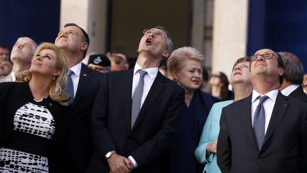 Croatia's President Kolinda Grabar-Kitarovic, Poland's President Andrzej Duda, NATO Secretary-General Jens Stoltenberg,Lithuania's President Dalia Grybauskaite, German Chancellor Angela Merkel and France's President Francois Hollande react as they observe a fly past during the NATO Summit in Warsaw, Poland July 8, 2016. Croatia's President Kolinda Grabar-Kitarovic, Poland's President Andrzej Duda, NATO Secretary-General Jens Stoltenberg,Lithuania's President Dalia Grybauskaite, German Chancellor Angela Merkel and France's President Francois Hollande react as they observe a fly past during the NATO Summit in Warsaw, Poland July 8, 2016. - Sputnik International