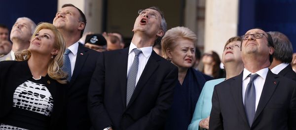 Croatia's President Kolinda Grabar-Kitarovic, Poland's President Andrzej Duda, NATO Secretary-General Jens Stoltenberg,Lithuania's President Dalia Grybauskaite, German Chancellor Angela Merkel and France's President Francois Hollande react as they observe a fly past during the NATO Summit in Warsaw, Poland July 8, 2016. - Sputnik International