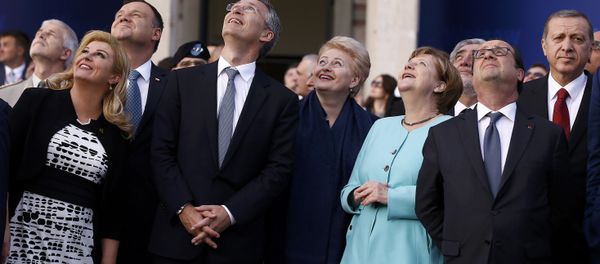 Croatia's President Kolinda Grabar-Kitarovic, Poland's President Andrzej Duda, NATO Secretary-General Jens Stoltenberg, Lithuania's President Dalia Grybauskaite, German Chancellor Angela Merkel, France's President Francois Hollande and Turkey's President Tayyip Erdogan react as they observe a fly past during the NATO Summit in Warsaw, Poland July 8, 2016. - Sputnik International