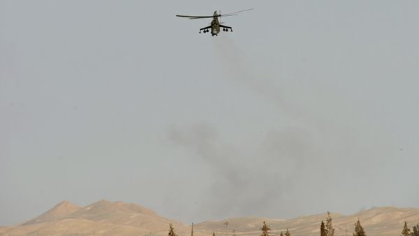 A Mi 24 helicopter of the Syrian army in the vicinity of Palmyra, Syria. A Mi 24 helicopter of the Syrian army in the vicinity of Palmyra, Syria. - Sputnik International