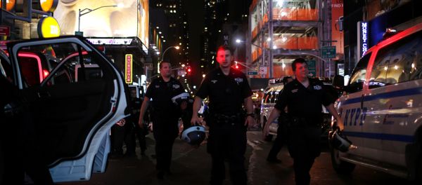 NYPD officers keep an eye on protesters as they go through Times Square taking part in a protest against the killing of Alton Sterling, Philando Castile and in support of Black Lives Matter during a march along Manhattan's streets in New York July 8, 2016. - Sputnik International