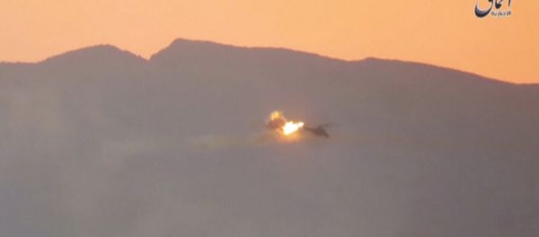 A still image taken on July 10, 2016 from a video posted by Islamic State's affiliated news agency Amaq purportedly shows the moment a helicopter is shot down east of Palmyra in Syria. - Sputnik International