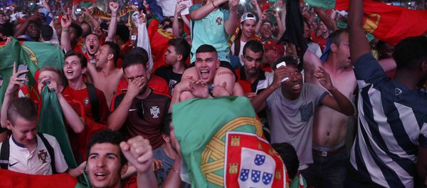 Portugal fans react at the fan zone after their team beat France in the Portugal v France EURO 2016 final soccer match in Paris, France, July 10, 2016 - Sputnik International