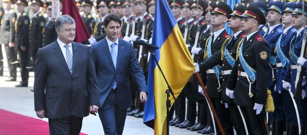 Ukrainian President Petro Poroshenko, left, and Canada Prime Minister Justin Trudeau review the honor guard during an official welcome ceremony ahead of their meeting in Kiev, Ukraine, Monday, July 11, 2016 Ukrainian President Petro Poroshenko, left, and Canada Prime Minister Justin Trudeau review the honor guard during an official welcome ceremony ahead of their meeting in Kiev, Ukraine, Monday, July 11, 2016 - Sputnik International