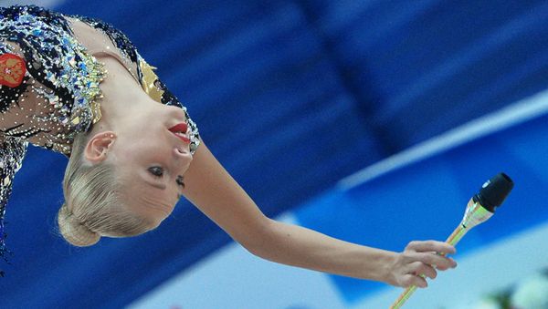 Russia's Yana Kudryavtseva performs a clubs routine during individual all-around at the 2016 Rhythmic Gymnastics World Cup Series in Kazan, Russia - Sputnik International