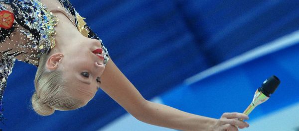 Russia's Yana Kudryavtseva performs a clubs routine during individual all-around at the 2016 Rhythmic Gymnastics World Cup Series in Kazan, Russia - Sputnik International