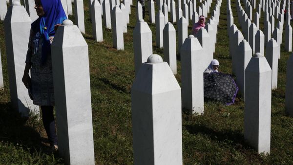 A Bosnian woman prays next to a coffin containing the remains of her relative perished in the Srebrenica massacre, during a funeral ceremony for the 127 victims at the Potocari memorial complex near Srebrenica, 150 kilometers (94 miles) northeast of Sarajevo, Bosnia and Herzegovina, Monday, July 11, 2016 A Bosnian woman prays next to a coffin containing the remains of her relative perished in the Srebrenica massacre, during a funeral ceremony for the 127 victims at the Potocari memorial complex near Srebrenica, 150 kilometers (94 miles) northeast of Sarajevo, Bosnia and Herzegovina, Monday, July 11, 2016 - Sputnik International