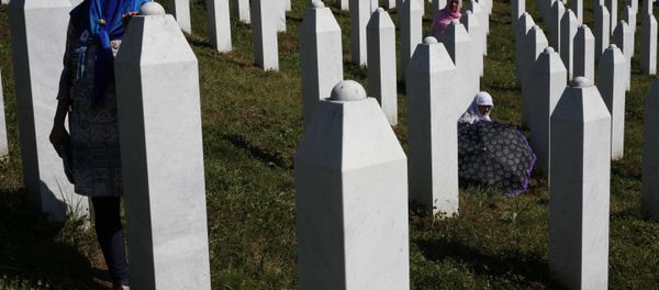 A Bosnian woman prays next to a coffin containing the remains of her relative perished in the Srebrenica massacre, during a funeral ceremony for the 127 victims at the Potocari memorial complex near Srebrenica, 150 kilometers (94 miles) northeast of Sarajevo, Bosnia and Herzegovina, Monday, July 11, 2016 A Bosnian woman prays next to a coffin containing the remains of her relative perished in the Srebrenica massacre, during a funeral ceremony for the 127 victims at the Potocari memorial complex near Srebrenica, 150 kilometers (94 miles) northeast of Sarajevo, Bosnia and Herzegovina, Monday, July 11, 2016 - Sputnik International