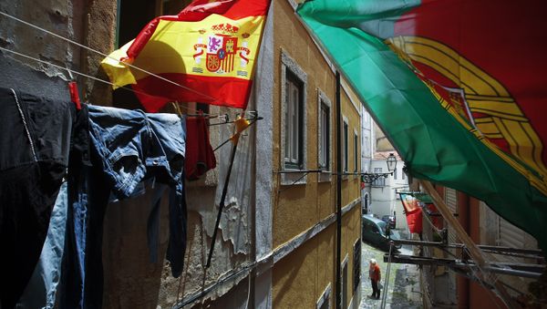 Portugal and Spain's flags wave at the balconies of a narrow street of Lisbon's Mouraria neighborhood (File) Portugal and Spain's flags wave at the balconies of a narrow street of Lisbon's Mouraria neighborhood (File) - Sputnik International