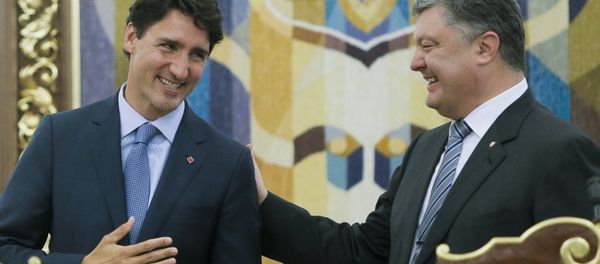 Ukrainian President Petro Poroshenko, right, and Canadian Prime Minister Justin Trudeau smile as they talk to each other during a signing ceremony in Kiev, Ukraine, Monday, July 11, 2016 Ukrainian President Petro Poroshenko, right, and Canadian Prime Minister Justin Trudeau smile as they talk to each other during a signing ceremony in Kiev, Ukraine, Monday, July 11, 2016 - Sputnik International