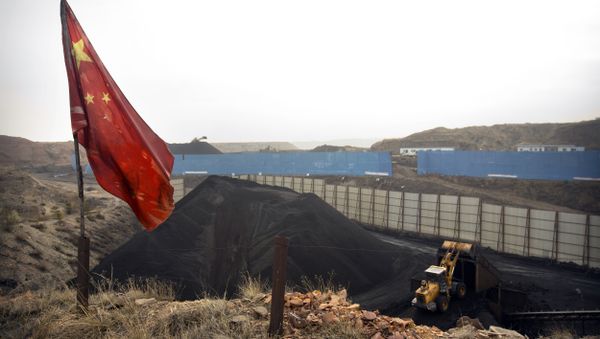 Chinese flag stands in the breeze as a loader moves coal at a coal mine near Ordos in northern China (File) Chinese flag stands in the breeze as a loader moves coal at a coal mine near Ordos in northern China (File) - Sputnik International
