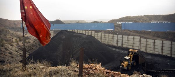 Chinese flag stands in the breeze as a loader moves coal at a coal mine near Ordos in northern China (File) Chinese flag stands in the breeze as a loader moves coal at a coal mine near Ordos in northern China (File) - Sputnik International