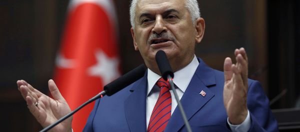 Turkey's Prime Minister Binali Yildirim addresses lawmakers at the parliament a day after he announced the details of an agreement reached with Israel. - Sputnik International