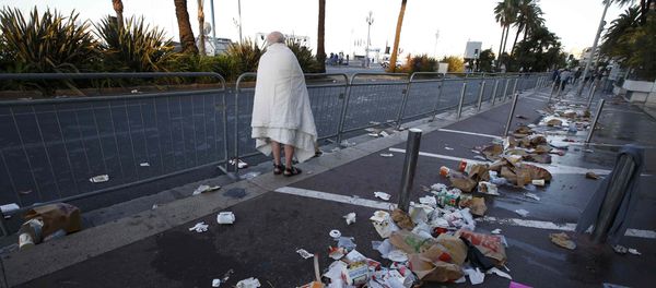 A man walks through debris scatterd on the street the day after a truck ran into a crowd at high speed killing scores celebrating the Bastille Day July 14 national holiday on the Promenade des Anglais in Nice, France, July 15, 2016. A man walks through debris scatterd on the street the day after a truck ran into a crowd at high speed killing scores celebrating the Bastille Day July 14 national holiday on the Promenade des Anglais in Nice, France, July 15, 2016. - Sputnik International