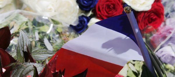 A bouquet of flowers and a French flag is seen as people pay tribute near the scene where a truck ran into a crowd at high speed killing scores and injuring more who were celebrating the Bastille Day national holiday, in Nice, France, July 15, 2016. A bouquet of flowers and a French flag is seen as people pay tribute near the scene where a truck ran into a crowd at high speed killing scores and injuring more who were celebrating the Bastille Day national holiday, in Nice, France, July 15, 2016. - Sputnik International