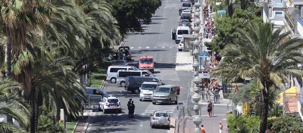 A photo taken on July 15, 2016 shows a police barricade set up at the site in Nice where a gunman smashed a truck into a crowd of revellers celebrating Bastille Day, killing at least 84 people. A photo taken on July 15, 2016 shows a police barricade set up at the site in Nice where a gunman smashed a truck into a crowd of revellers celebrating Bastille Day, killing at least 84 people. - Sputnik International