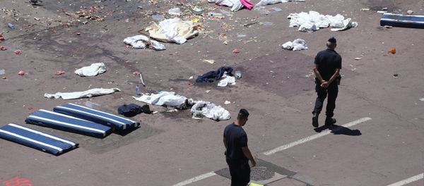 French gendarmes walk past clothes and mattresses at the site of the deadly attack on the Promenade des Anglais seafront in the French Riviera city of Nice on July 15, 2016, after a gunman smashed a truck through a crowd celebrating Bastille Day, killing at least 84 and injuring dozens - Sputnik International