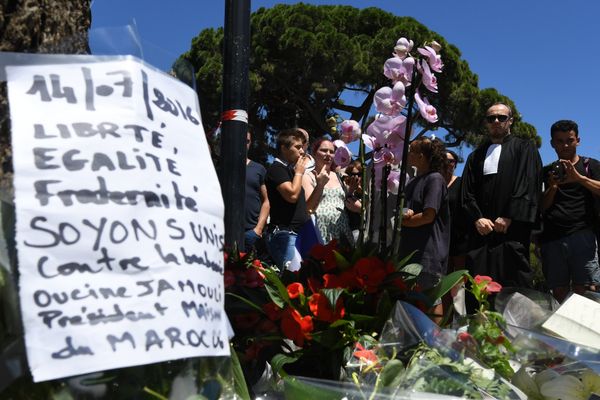 A sign reading Liberty, equality, fraternity, let us unite against barbarism is placed on July 15, 2016 at a makeshift memorial near the site in Nice where a gunman smashed a truck into a crowd of revellers celebrating Bastille Day, killing at least 84 people. A sign reading Liberty, equality, fraternity, let us unite against barbarism is placed on July 15, 2016 at a makeshift memorial near the site in Nice where a gunman smashed a truck into a crowd of revellers celebrating Bastille Day, killing at least 84 people. - Sputnik International